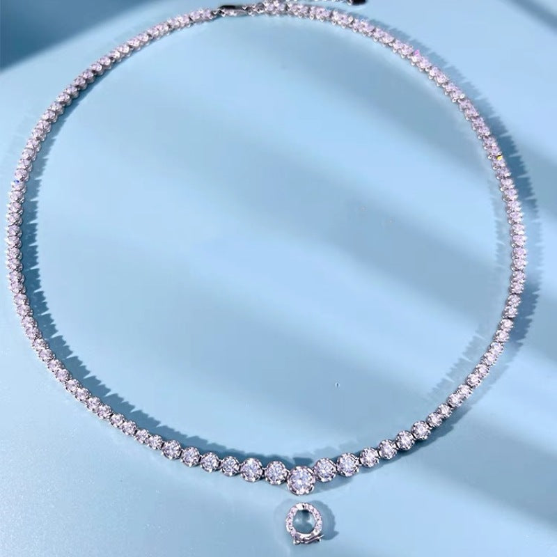 A versatile, high-end necklace with a full diamond clasp and a multi-purpose chain. It features a unique design and a sophisticated, understated style.