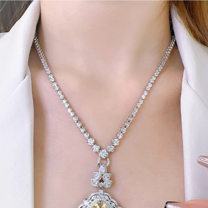 A versatile, high-end necklace with a full diamond clasp and a multi-purpose chain. It features a unique design and a sophisticated, understated style.